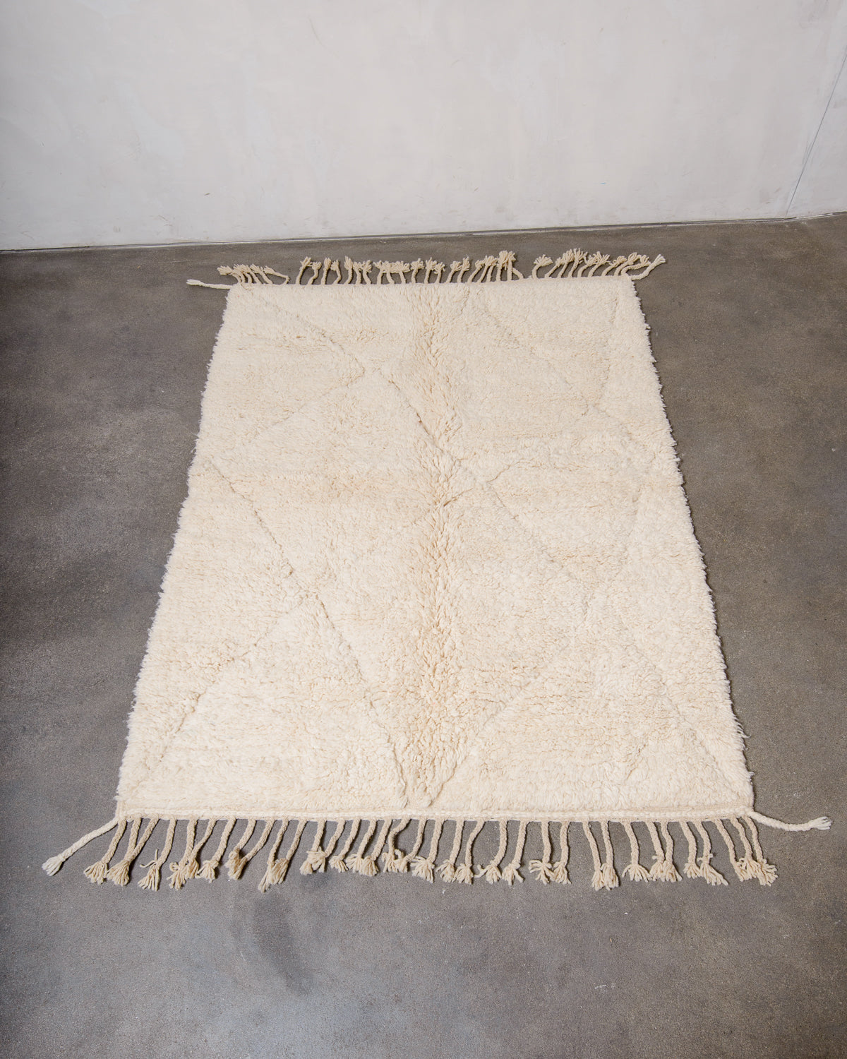 Modern, designer, handcrafted Berber rug from Morocco. Beniourain carpet with minimalist design, natural wool pile and a fluffy texture.